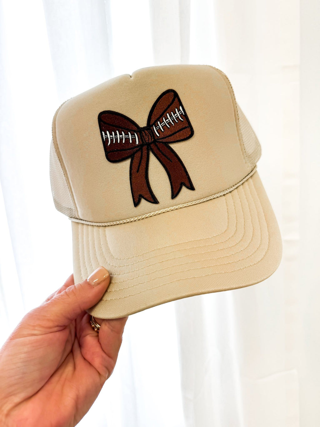 football bow trucker hat